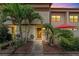 Charming townhome with lush tropical landscaping and a welcoming front entrance at 9209 Seminole Blvd # 156, Seminole, FL 33772