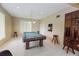 A game room with tile flooring, a pool table, wooden stools, and recessed lighting at 9209 Seminole Blvd # 156, Seminole, FL 33772