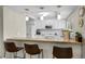 Bright kitchen with granite countertops, white cabinetry, and modern appliances at 9209 Seminole Blvd # 156, Seminole, FL 33772
