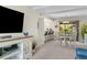 Bright living room with an adjacent dining area and kitchen featuring bar stool seating at 9209 Seminole Blvd # 156, Seminole, FL 33772