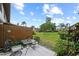 Private patio area with table and chairs, surrounded by well-maintained landscaping at 9209 Seminole Blvd # 156, Seminole, FL 33772