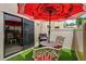 Patio area with an outdoor grill, an umbrella, and patio furniture, seen from another angle at 9209 Seminole Blvd # 156, Seminole, FL 33772