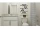Bright bathroom featuring a vanity with a granite countertop and decorative wall art at 9333 Bonita Mar Dr, Parrish, FL 34219