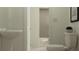 Bathroom featuring tiled floors, pedestal sink, and efficient fixtures at 9333 Bonita Mar Dr, Parrish, FL 34219