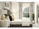 Bright bedroom with neutral walls, modern art, and a comfortable, inviting bed at 9333 Bonita Mar Dr, Parrish, FL 34219
