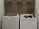 Functional laundry area with a full-size washer and dryer at 9333 Bonita Mar Dr, Parrish, FL 34219