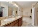 This bathroom boasts a dual sink vanity, a soaking tub, and a separate shower, perfect for relaxation at 9520 Trumpet Vine Loop, Trinity, FL 34655