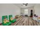Bonus room offers lots of space for activities and features luxury vinyl plank flooring at 9520 Trumpet Vine Loop, Trinity, FL 34655