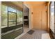Enclosed patio shows a door to the outside as well as a sliding door leading into the house at 9520 Trumpet Vine Loop, Trinity, FL 34655