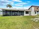 This home boasts a lush backyard with a cozy screened-in lanai, perfect for enjoying the outdoors at 9907 Island Harbor Dr, Port Richey, FL 34668