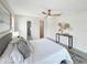 Serene bedroom with a comfortable bed, stylish decor, and a peek into the en-suite bathroom at 9907 Island Harbor Dr, Port Richey, FL 34668