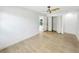 This bedroom has tile floors, a ceiling fan and an entrance to a closet at 9907 Island Harbor Dr, Port Richey, FL 34668