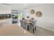 Cozy dining area adjacent to the kitchen with modern decor and sliding glass doors at 9907 Island Harbor Dr, Port Richey, FL 34668