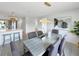 Dining area next to the kitchen, featuring a modern table, chairs, and stylish decor at 9907 Island Harbor Dr, Port Richey, FL 34668