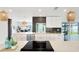 Bright, modern kitchen with white cabinetry, quartz countertops, and stainless steel appliances at 9907 Island Harbor Dr, Port Richey, FL 34668