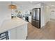 Bright, open kitchen with stainless steel appliances, white countertops, and an adjacent dining area at 9907 Island Harbor Dr, Port Richey, FL 34668