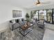 Comfortable living room with natural light, neutral decor, and stylish furnishings for relaxed living at 9907 Island Harbor Dr, Port Richey, FL 34668