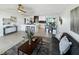 Open-concept living space with kitchen island, modern furniture, and decorative accents throughout at 9907 Island Harbor Dr, Port Richey, FL 34668