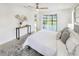 This main bedroom features a sliding glass door leading to an outdoor patio at 9907 Island Harbor Dr, Port Richey, FL 34668