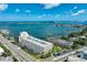 Stunning aerial view of the condominium complex with beautiful ocean and inter-coastal views and boat docks at 100 Bluff View Dr # 405A, Belleair Bluffs, FL 33770