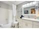 Clean bathroom with a shower-tub combo, and a modern vanity with ample storage and neutral paint at 100 Bluff View Dr # 405A, Belleair Bluffs, FL 33770