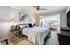 Bright bedroom featuring stylish decor, a comfortable bed, and French doors leading to a bonus room at 100 Bluff View Dr # 405A, Belleair Bluffs, FL 33770