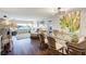 Open concept living and dining area with stylish decor, hardwood floors and views of the inter-coastal at 100 Bluff View Dr # 405A, Belleair Bluffs, FL 33770