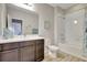 Bathroom with dark wood cabinets, shower over tub, and a mirror in a well-lit space at 10415 Cardera Dr, Riverview, FL 33578