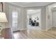 Welcoming foyer leading to a home office, featuring stylish tile flooring and natural light at 10415 Cardera Dr, Riverview, FL 33578