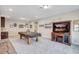 Spacious game room featuring a pool table, TV, and comfortable seating with neutral carpet at 10415 Cardera Dr, Riverview, FL 33578