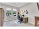 Home office featuring a built-in desk, neutral walls, and ample natural light from the window at 10415 Cardera Dr, Riverview, FL 33578