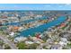 Stunning waterfront home with boat dock and access to the Gulf, surrounded by beautiful landscaping and city views at 106 Midway Is, Clearwater Beach, FL 33767