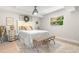 Cozy bedroom with queen bed, natural light, and decorative furnishings at 106 Midway Is, Clearwater Beach, FL 33767