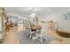 Inviting dining space adjacent to the living room features seating for six and designer furniture at 106 Midway Is, Clearwater Beach, FL 33767