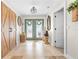 The front foyer features patterned tile flooring, decorative doors, elegant lighting, and unique decorative accents at 106 Midway Is, Clearwater Beach, FL 33767