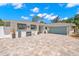 Inviting home boasts a well-kept exterior, complemented by a large driveway and tasteful landscaping at 106 Midway Is, Clearwater Beach, FL 33767