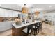 Open kitchen features a large island with quartz countertops, modern lighting, and stainless appliances at 106 Midway Is, Clearwater Beach, FL 33767