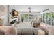 Open living area with modern design, fireplace, and patio doors with views of the canal at 106 Midway Is, Clearwater Beach, FL 33767