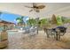Relaxing outdoor patio with dining and lounge seating overlooking the pool and waterfront at 106 Midway Is, Clearwater Beach, FL 33767
