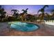 Pool with mature landscaping, a private dock, and perfect for evening relaxation at 106 Midway Is, Clearwater Beach, FL 33767