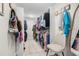 Organized walk-in closet with ample hanging space and a comfortable seating area at 106 Midway Is, Clearwater Beach, FL 33767