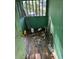 Small indoor room with a window and some trash on the wooden floors, in need of some TLC at 1118 E Linebaugh Ave, Tampa, FL 33612