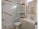 Updated bathroom featuring a shower, grab bar, and modern vanity at 1126 Tarridon Ct, Dunedin, FL 34698