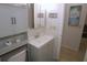 Well-maintained bathroom with modern vanity, mirror, and decorative elements at 1126 Tarridon Ct, Dunedin, FL 34698