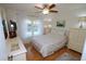 Charming bedroom with a ceiling fan, window, and ample natural light at 1126 Tarridon Ct, Dunedin, FL 34698