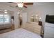 Spacious bedroom with large closet, ceiling fan, and well-lit interior at 1126 Tarridon Ct, Dunedin, FL 34698