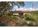 Community clubhouse showcasing well-manicured landscaping and a welcoming entrance at 1126 Tarridon Ct, Dunedin, FL 34698