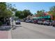 Charming downtown street view featuring colorful shops and parked cars on a sunny day at 1126 Tarridon Ct, Dunedin, FL 34698