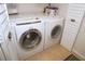 Convenient laundry room equipped with a modern washer and dryer set at 1126 Tarridon Ct, Dunedin, FL 34698