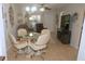 Inviting living room featuring a modern glass table, comfortable seating, and a ceiling fan at 1126 Tarridon Ct, Dunedin, FL 34698